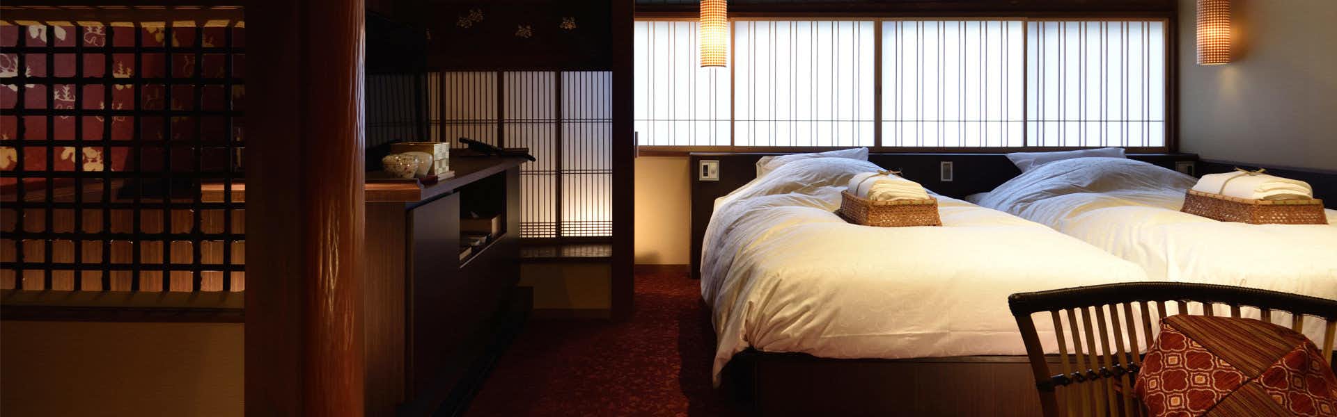 Kyokoyado Muromachi Yutone with a warm twin bedroom with shoji screens and timber details.