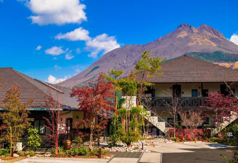 Property exterior with a mountain backdrop.