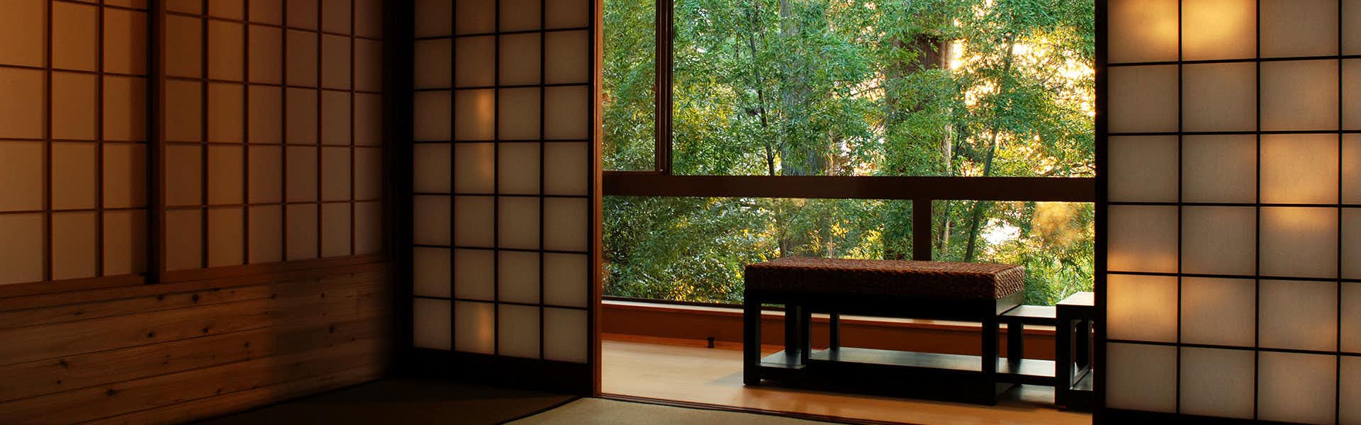 Yamashiro Onsen Yoshidaya Sannoukaku dim tatami alcove opening toward sunlit forest windows