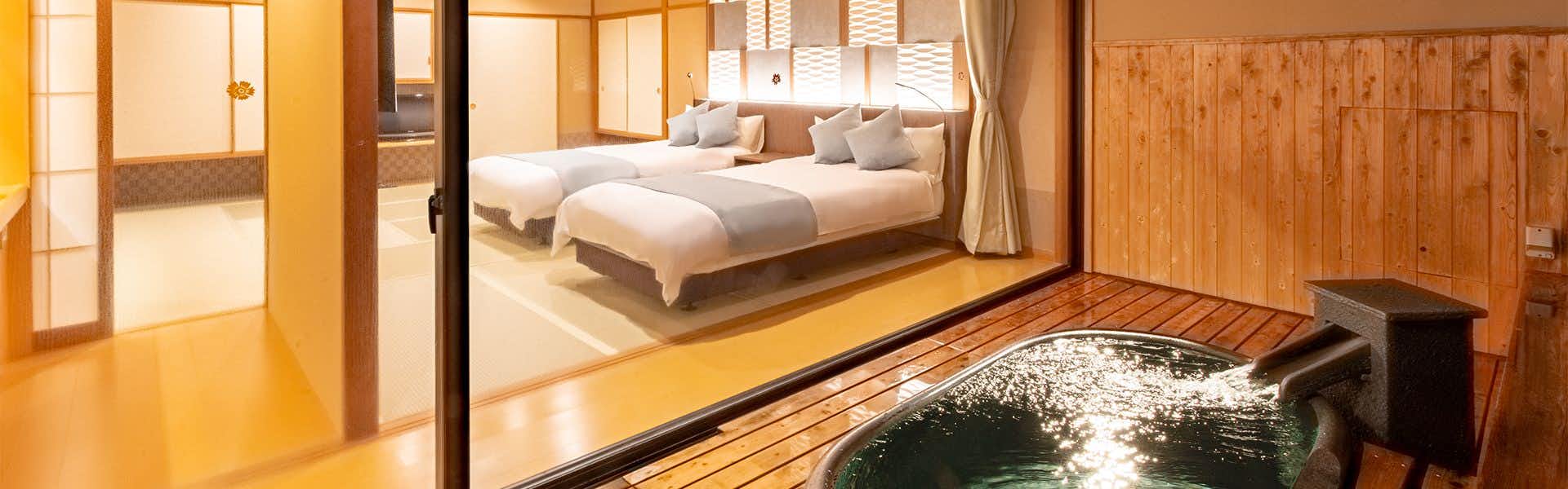 Ryokusuitei Keisui with a bright twin bedroom beside a private soaking bath.