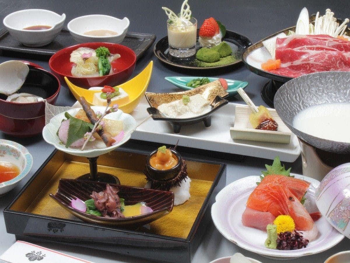 Hotel Seikouen with a seasonal Japanese dinner arranged across colorful ceramics.