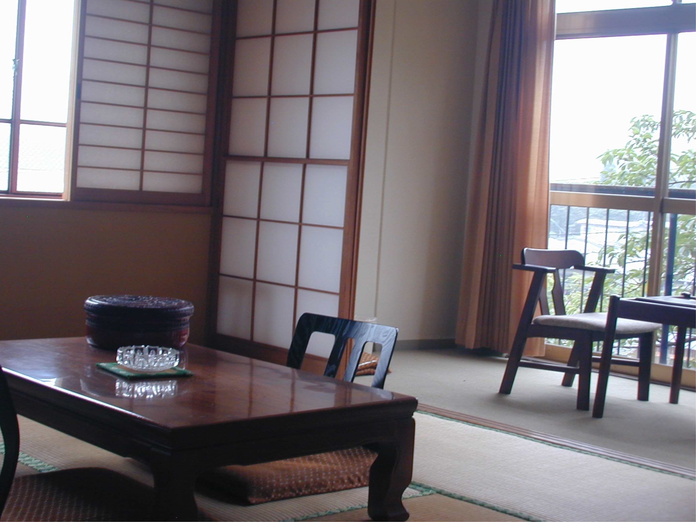 Guest room seating area beside a low table.