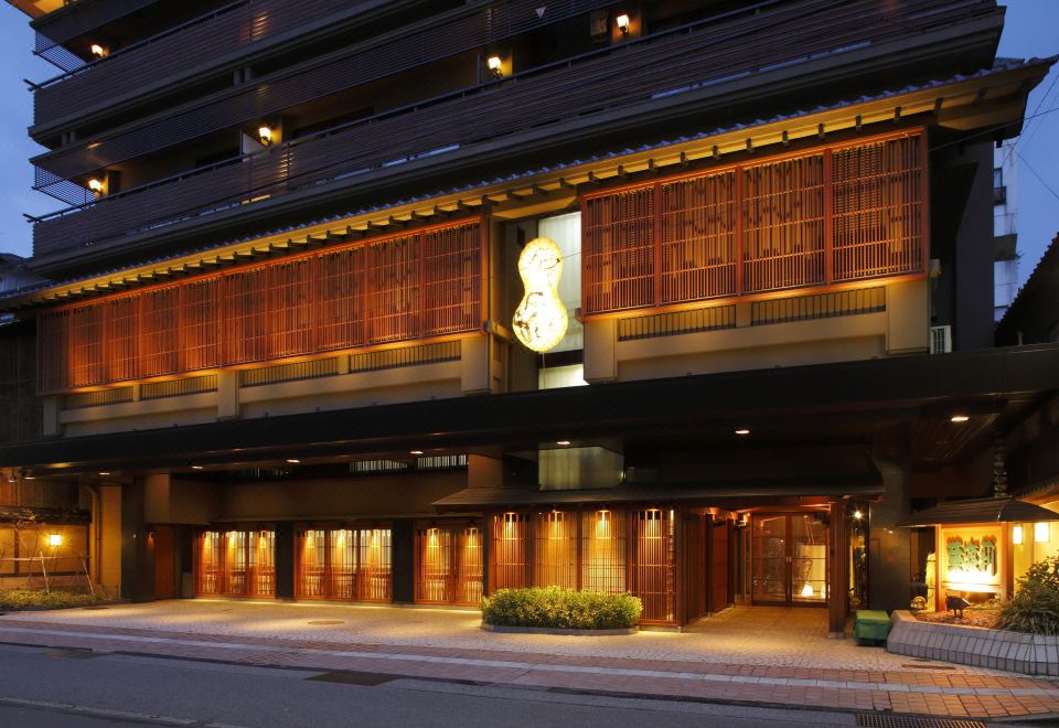 Ryokan exterior at night.