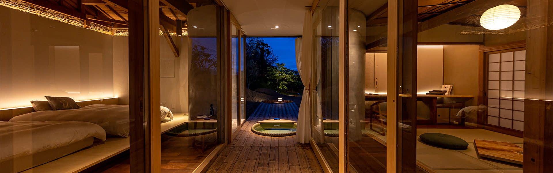 Oki Olive Guesthouse with a long timber corridor linking the bedroom and private terrace.