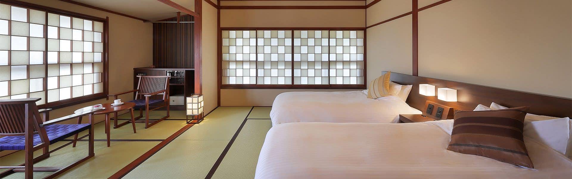 Omiya Ryokan with a spacious guest room with purple sofa and window seating.