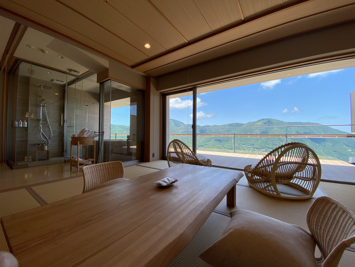 Guest room with seating and a mountain view.