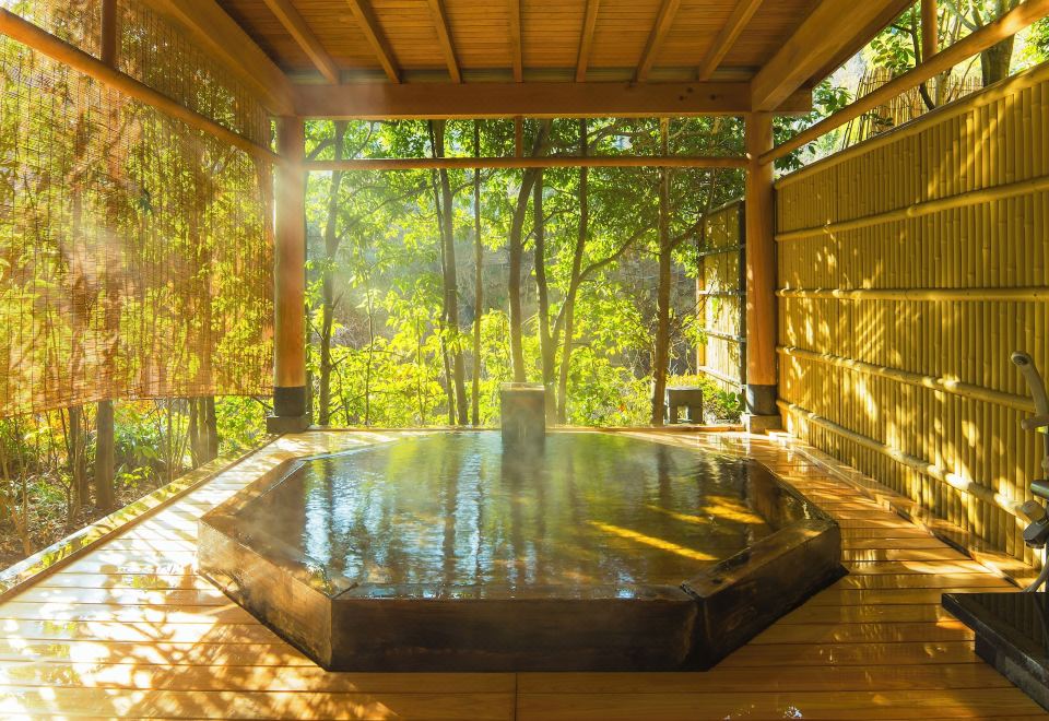 Outdoor bath among trees.