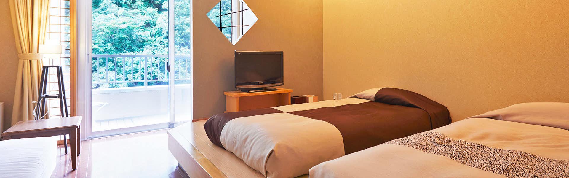 Furusato Inn of Four Seasons Colors with a bright twin bedroom opening toward the garden.