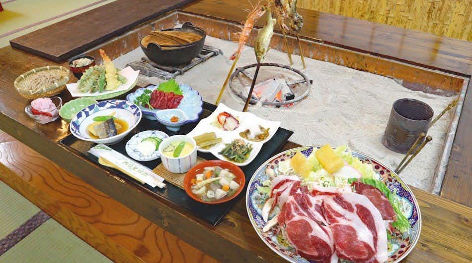 Irori Yuno Yado Osakaya with a generous Japanese dinner arranged around an open hearth.