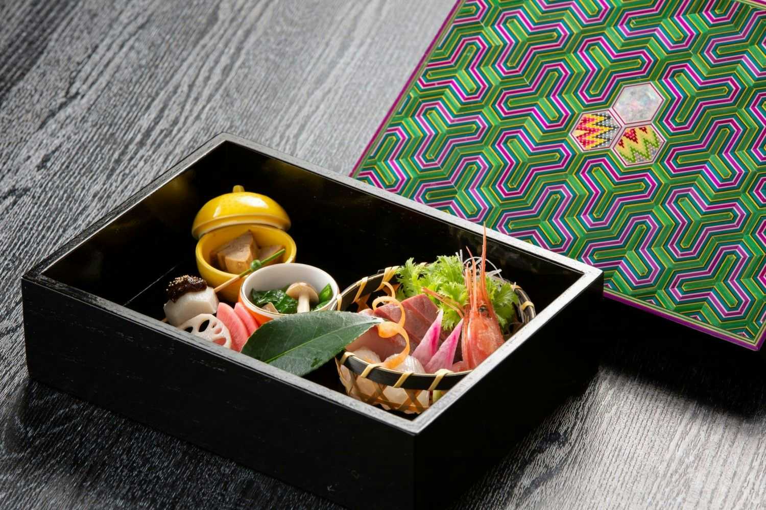 Oyado Maruya with seasonal appetizers arranged inside a patterned lacquer box.
