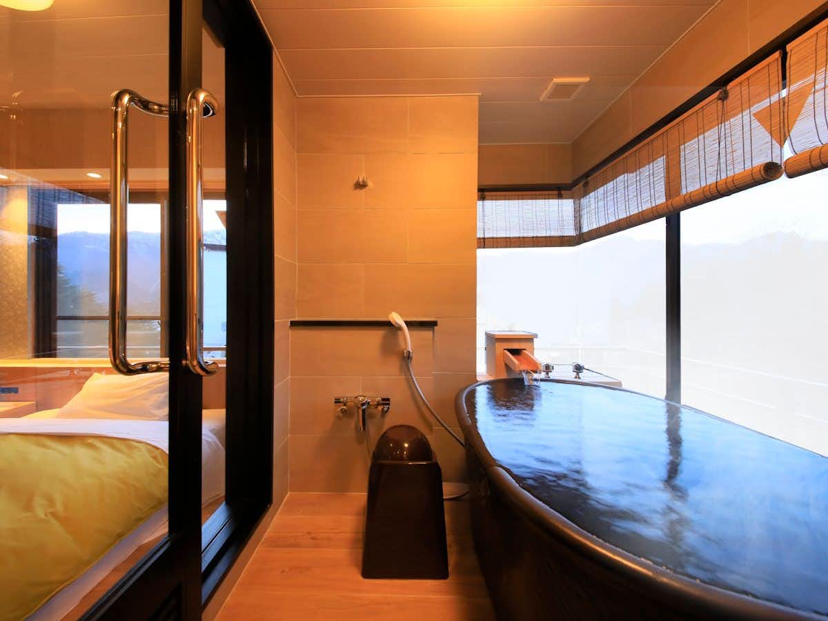 Naruko Fuga with a private round bath beside broad mountain windows.
