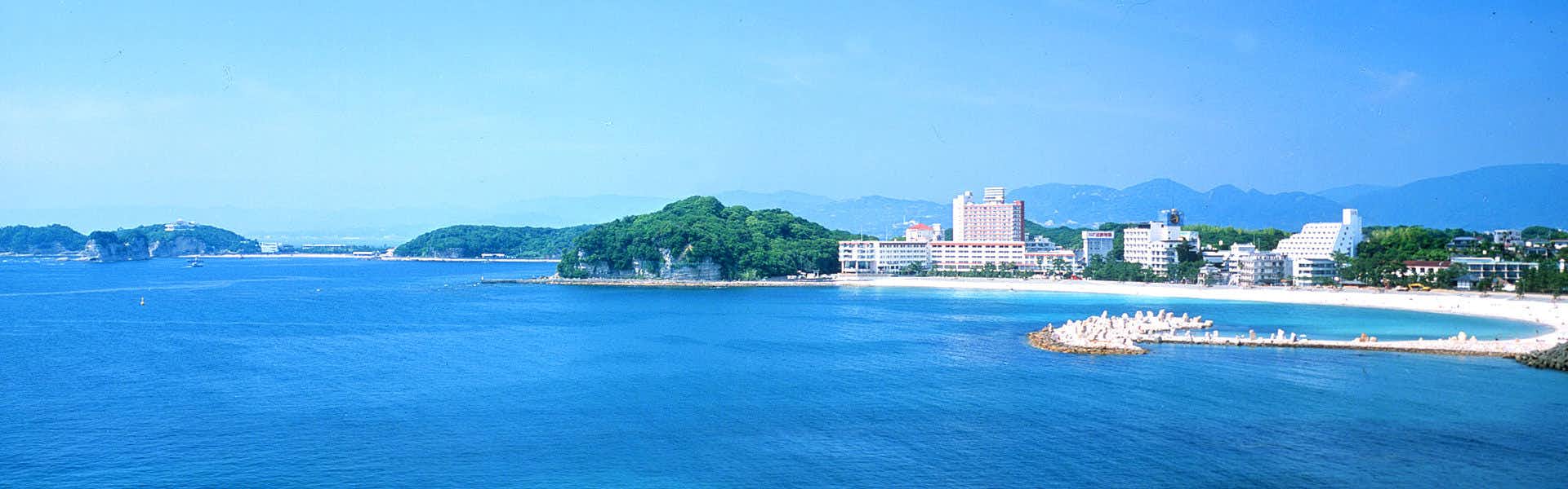 Shirahama Inn Yanagiya with a panoramic view across blue sea and coastal hills.