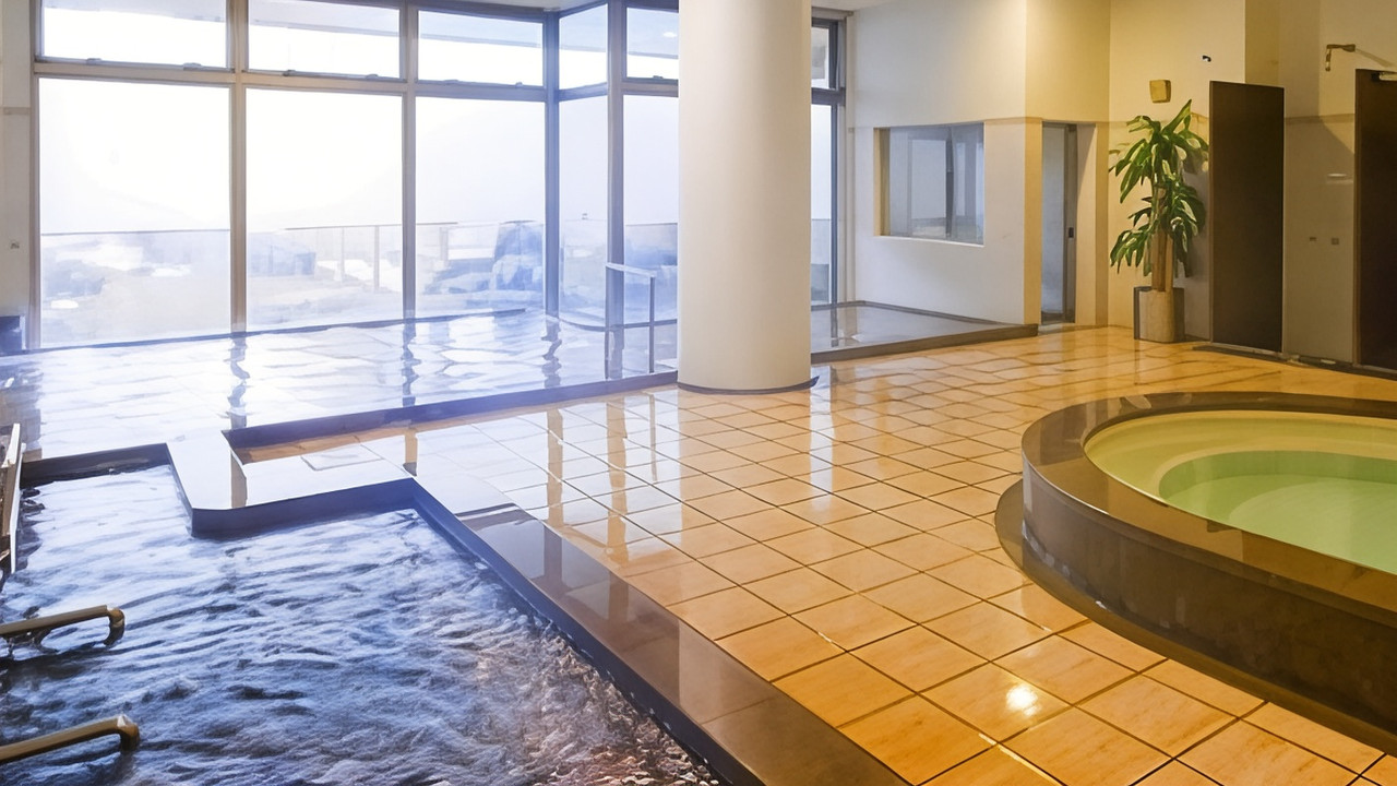 Indoor bath with a window view.