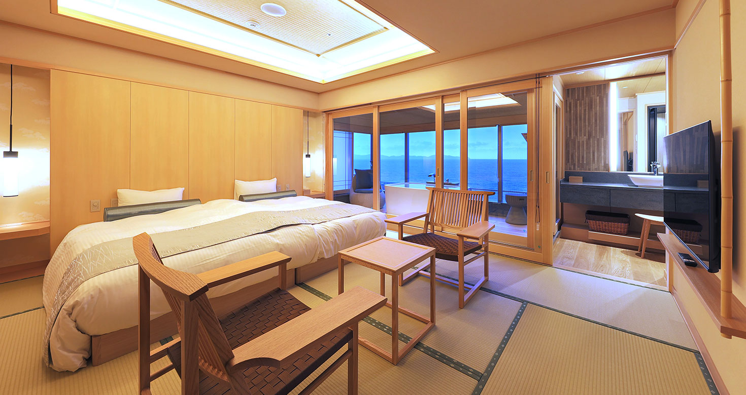 A spacious sea-view room combining beds and tatami flooring.