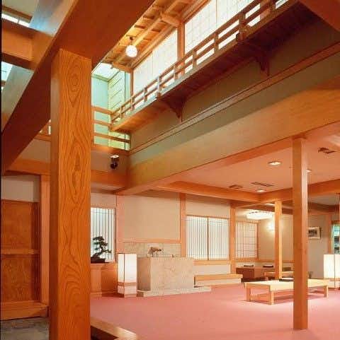 Shima Onsen Private Bath Inn Jyojukan with a timber lobby with red carpet.