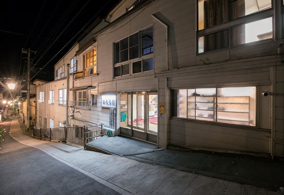 Street-facing exterior at night.
