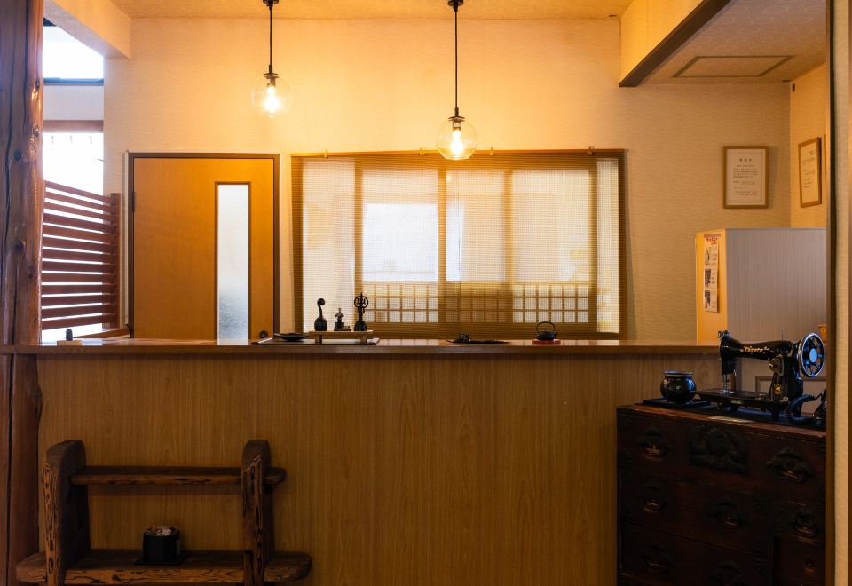A reception counter with hanging lights.