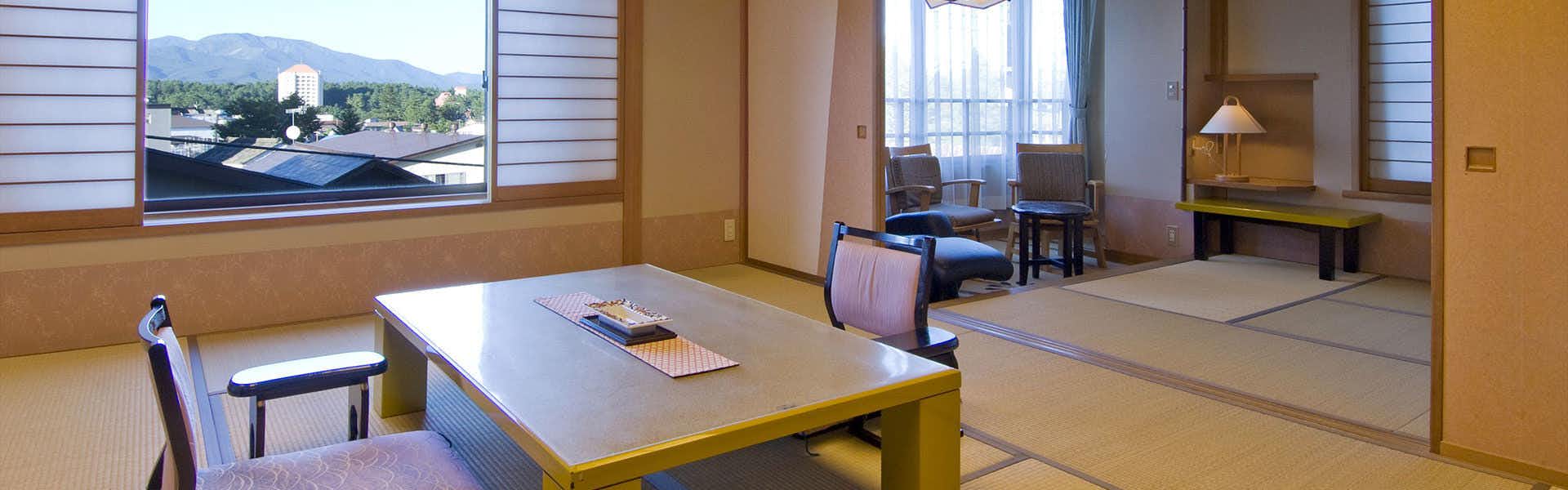 Kanemidori with a traditional tatami room with low table and mountain window.
