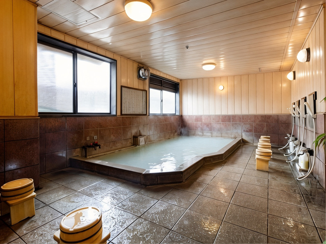 Indoor bath with a broad tiled pool.