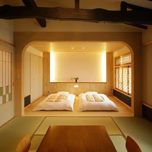 A serene sleeping alcove with twin white futons.