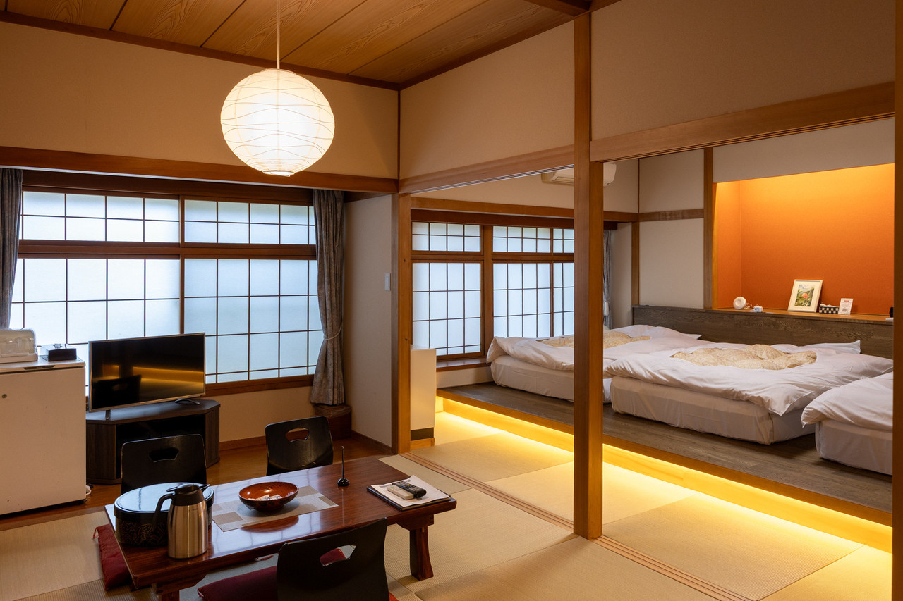 A Japanese-style room combines bedding with a low table.