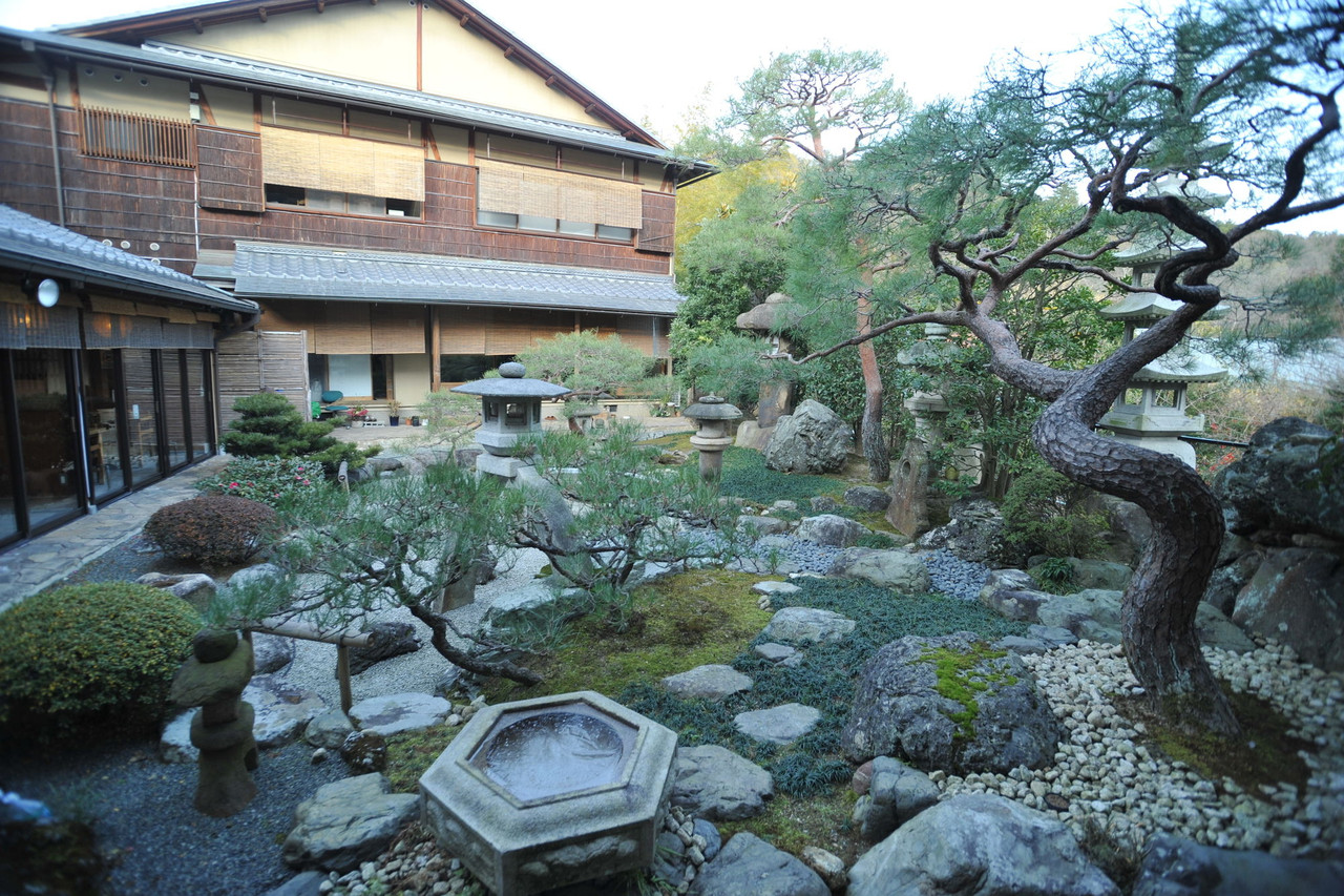 Traditional building beside a stone garden path.