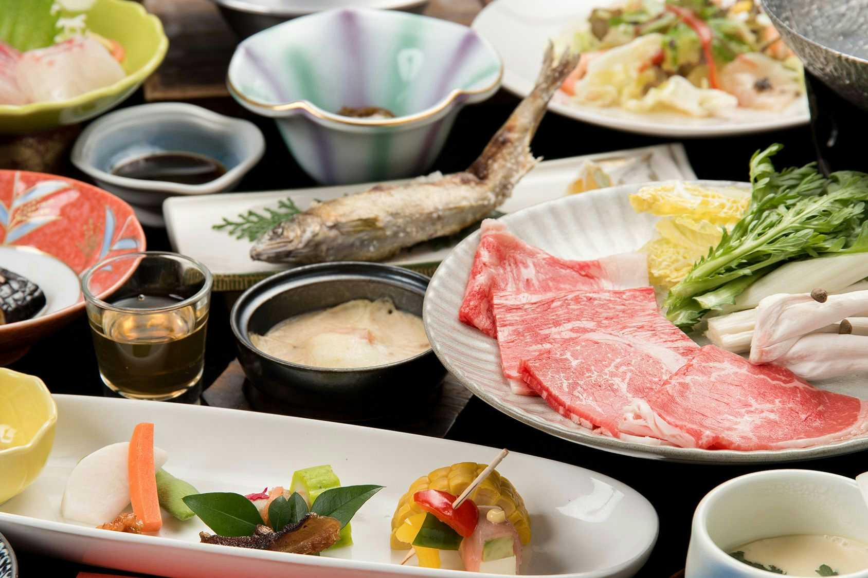 Sanso Matsuya a meal spread arranged across a dark dining table.