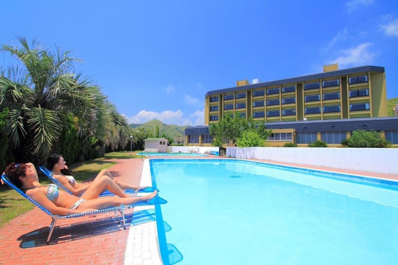 Outdoor swimming pool beside the hotel.