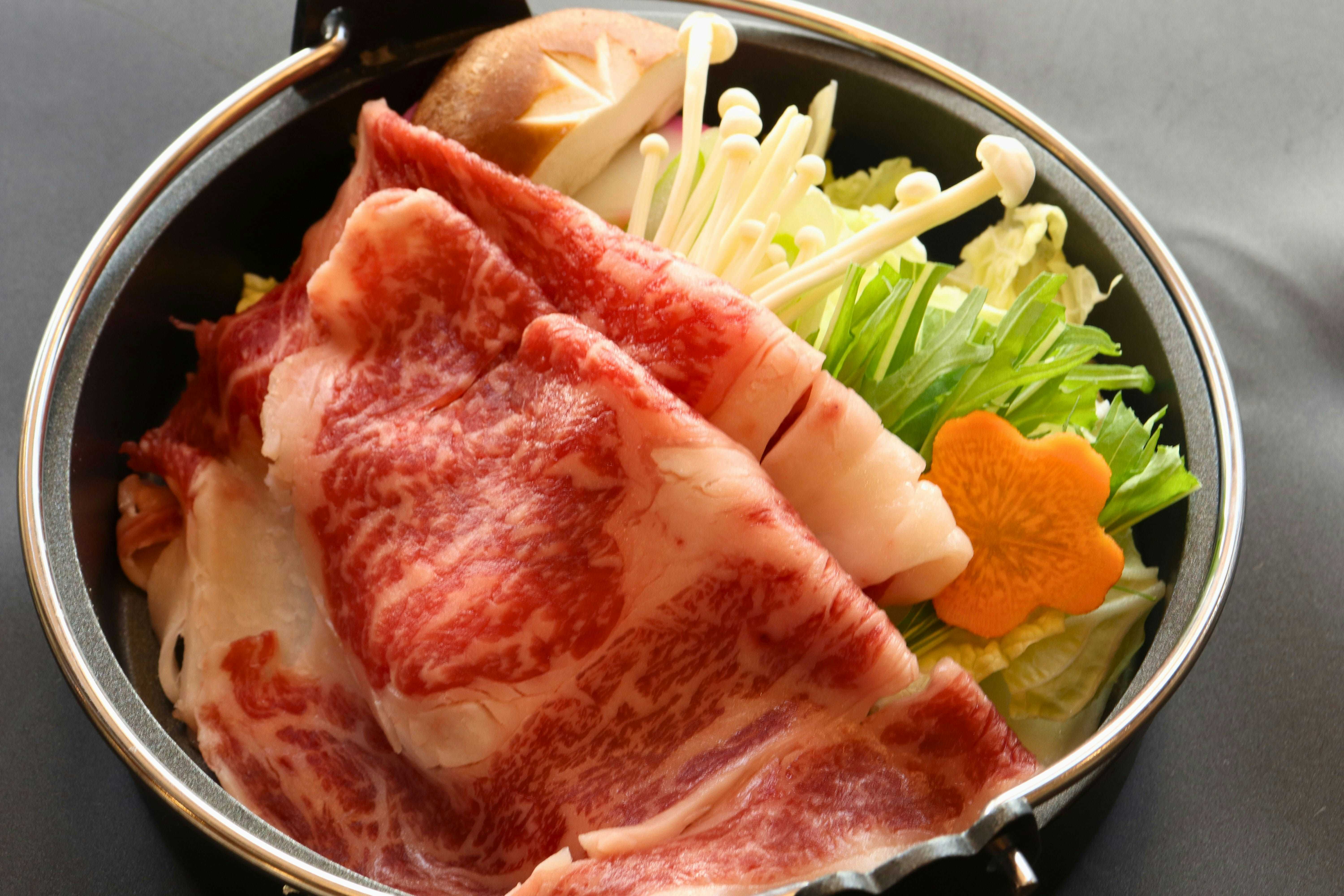 Three Private Hot Spring Baths with Free-Flowing Water - Yuyado Onsen Taiyokan with marbled beef and vegetables arranged for hot pot.