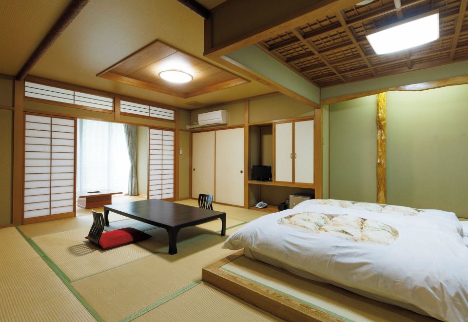 A Japanese guest room prepared with futons.