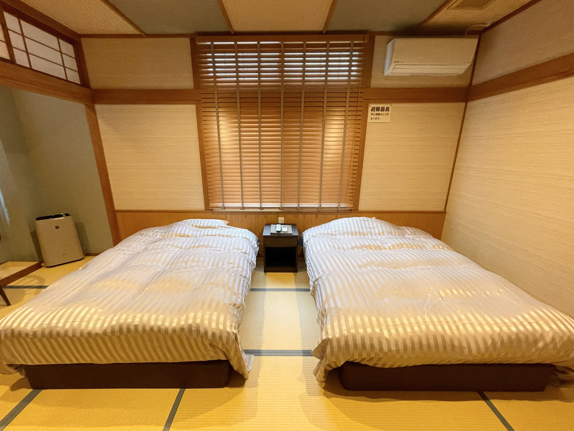 A tatami sleeping room with twin beds.