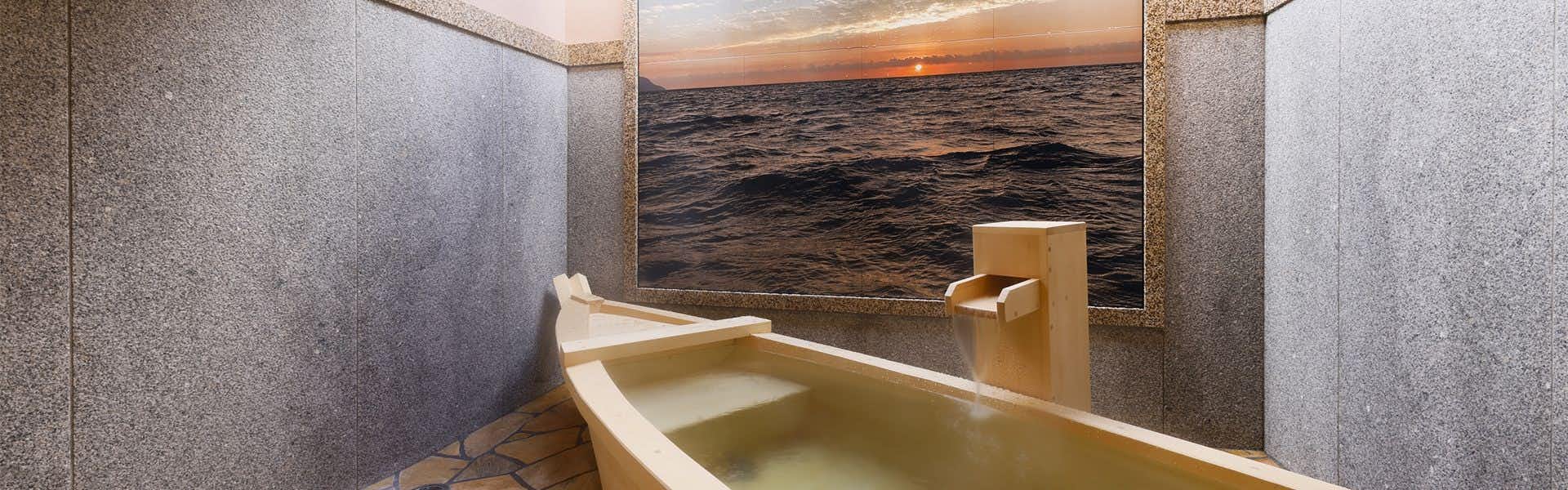Kangin no Hanare Fuugetsu Gyoshou with a private stone bath facing a textured feature wall.