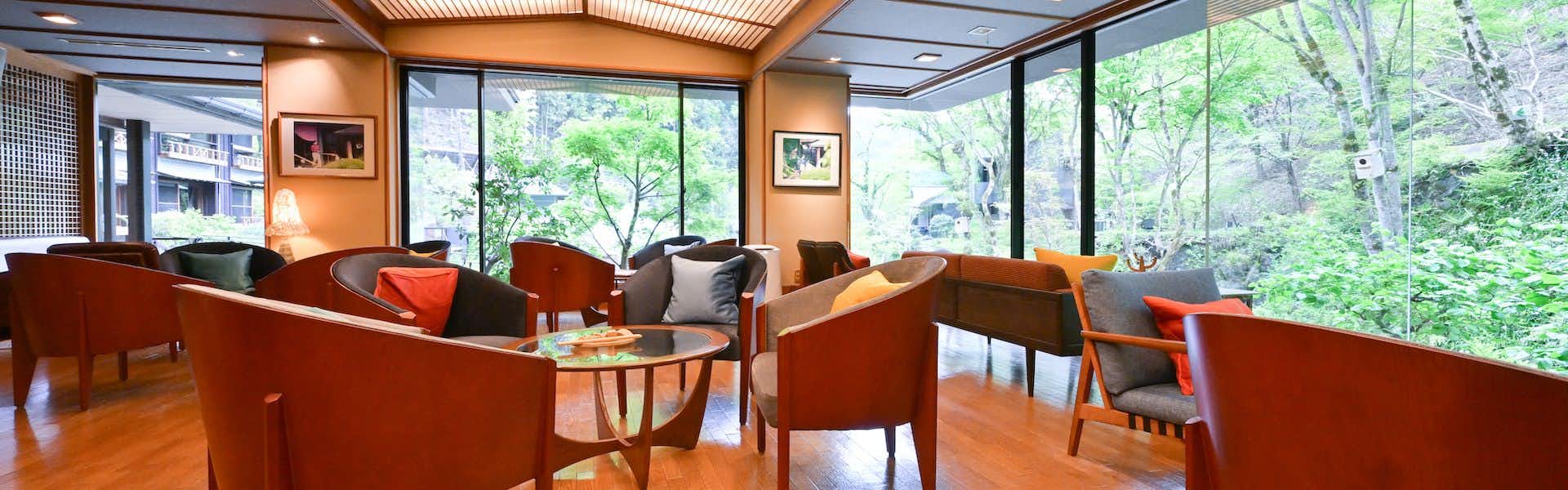 taishoukaku lounge chairs arranged before broad garden windows