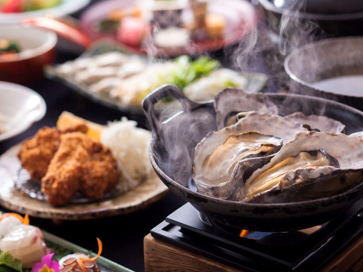 Ginpaso Inn with Spectacular Open-Air Bath with steaming oysters served beside fried seafood and small dishes.