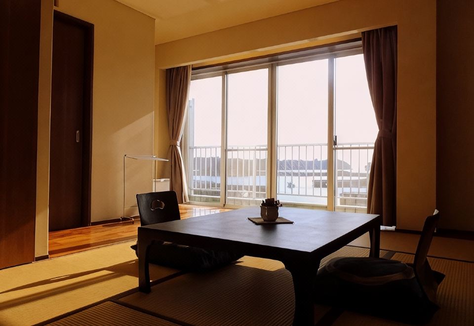 Room with a low table and sea view.