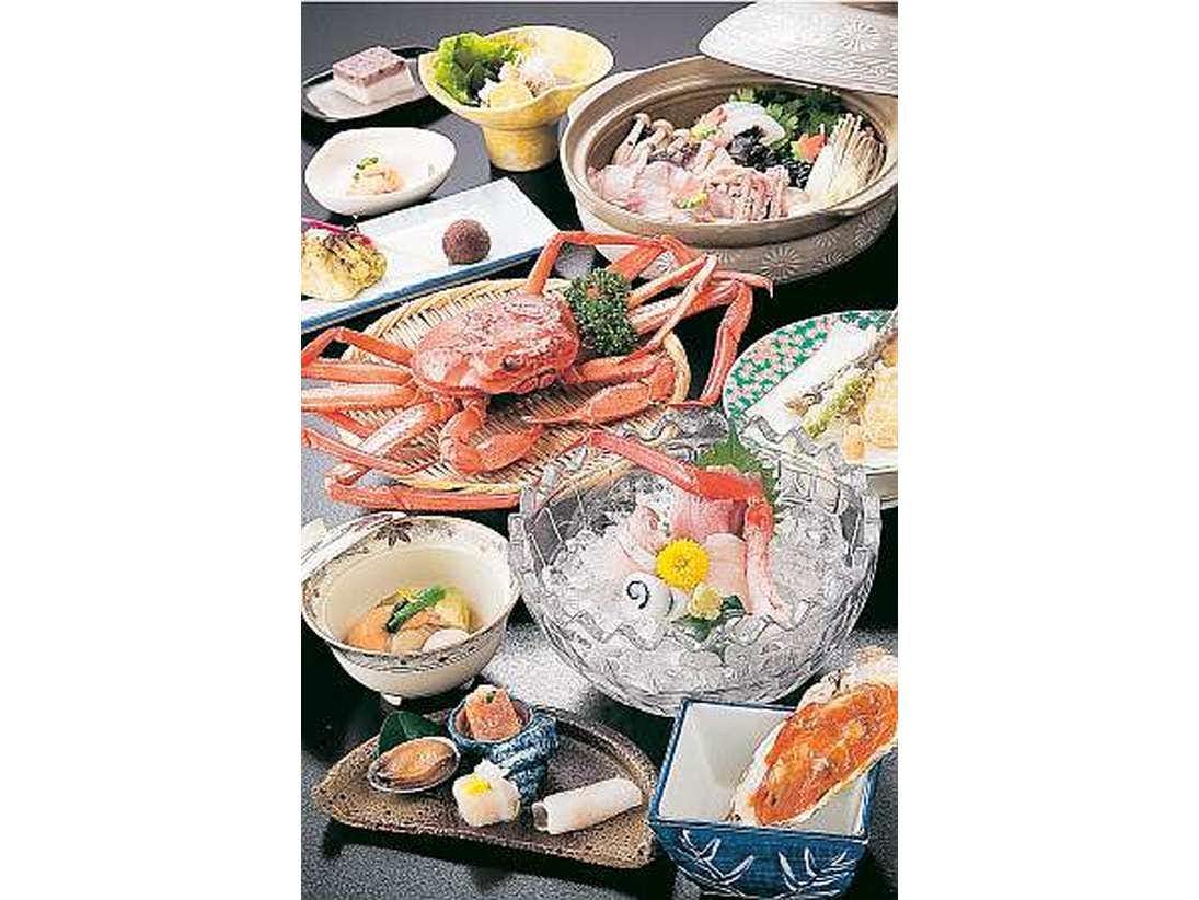 Seafood Inn Ryotei Kotaki with a generous seafood dinner arranged across colorful platters.