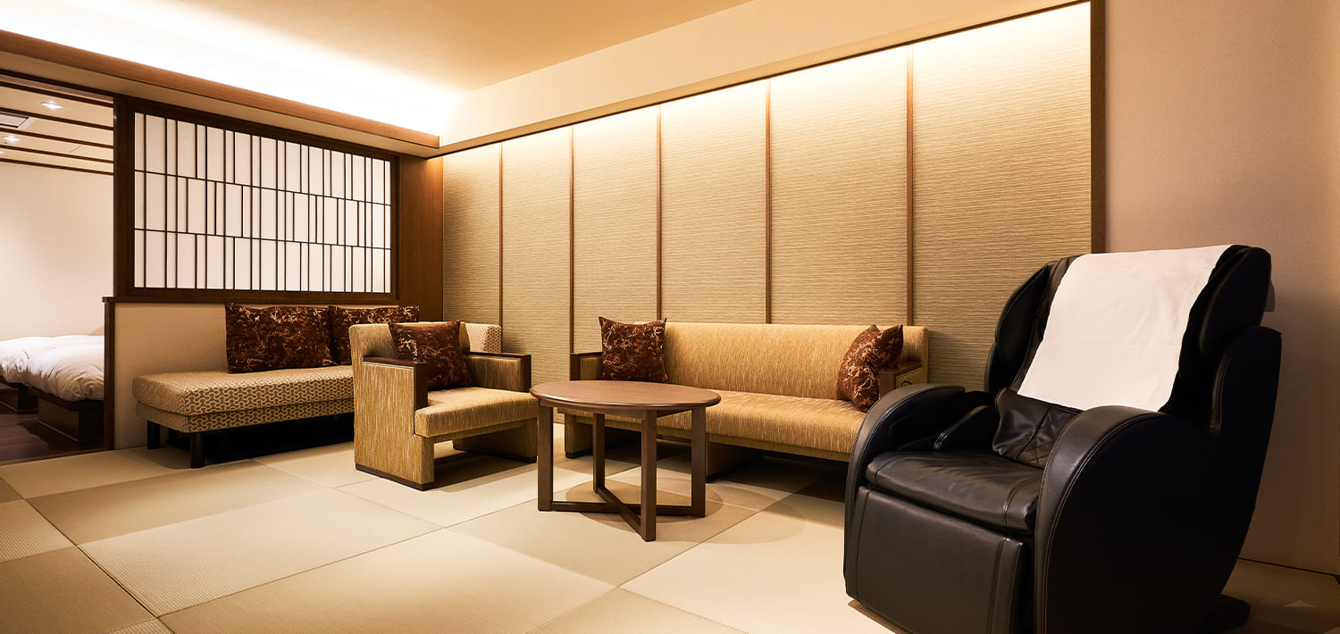 Tatami lounge area with armchairs.