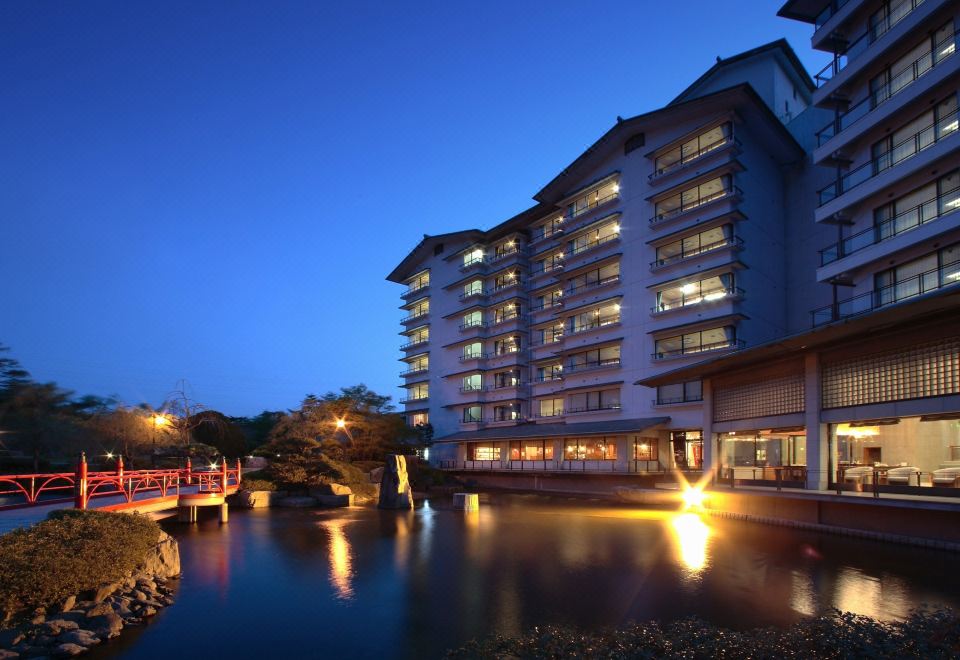 An illuminated hotel building.