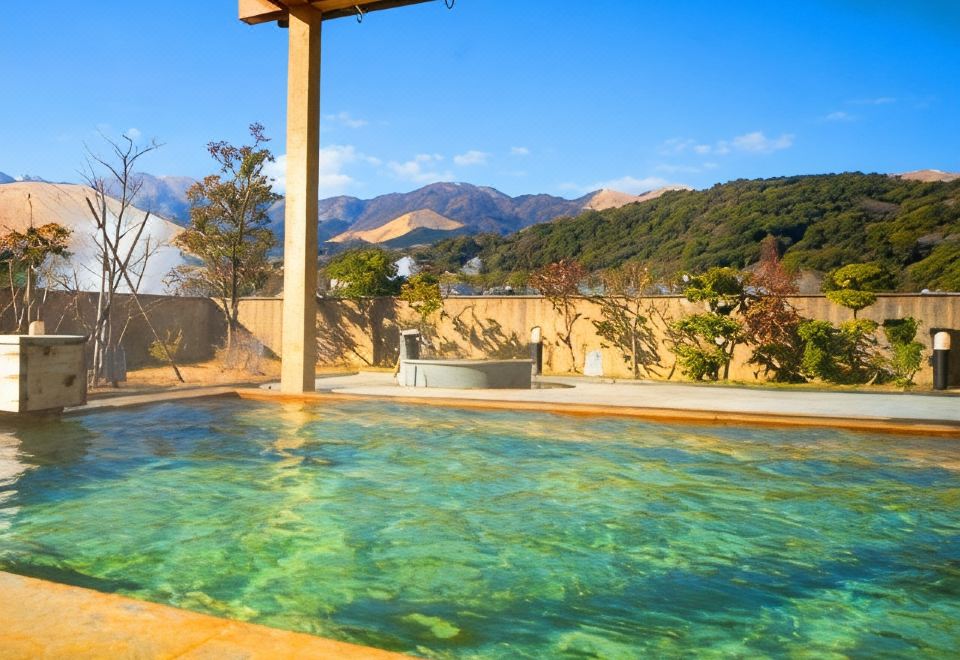 Outdoor pool with a mountain view.