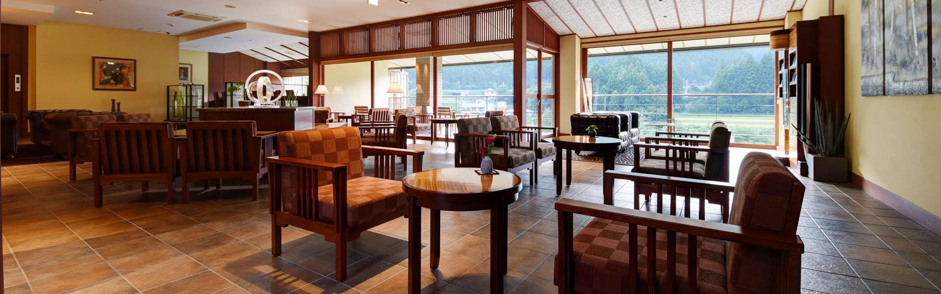 Wakatake no Shou Bettei Sasane with a bright dining room with timber tables and valley windows.