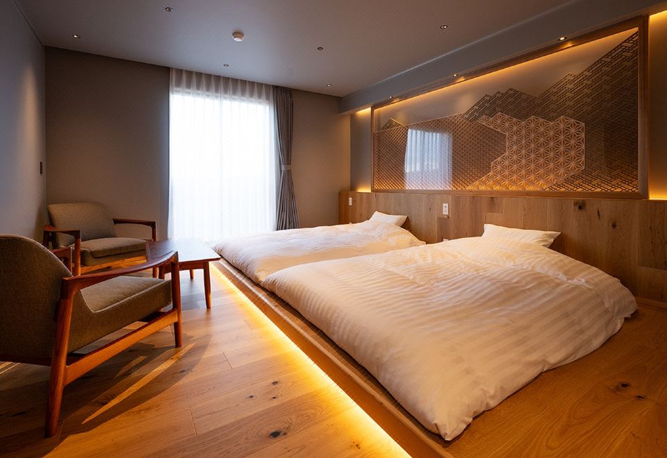 A modern bedroom with a large bed.