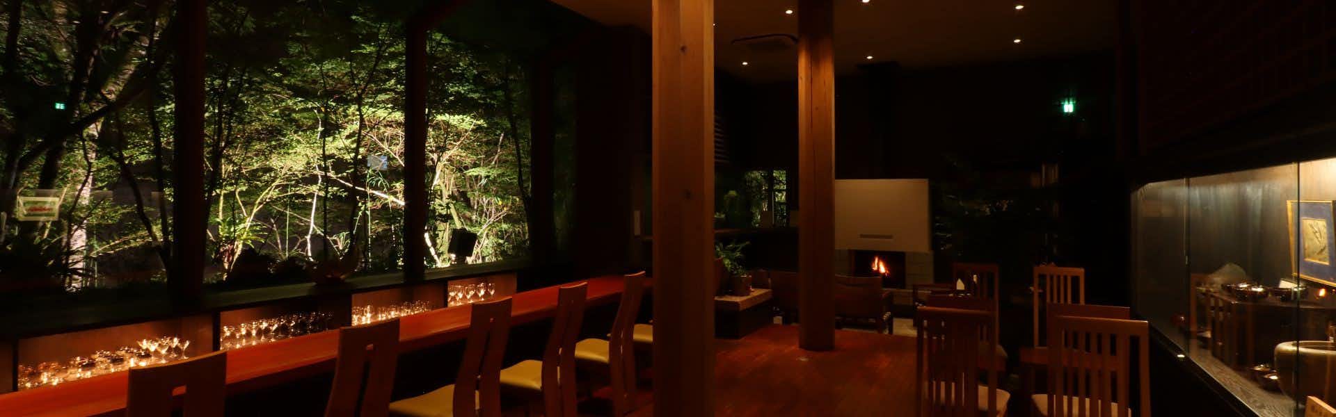Kitago Neiroka no Toki Nemunohana dim wooden dining room beside night garden windows