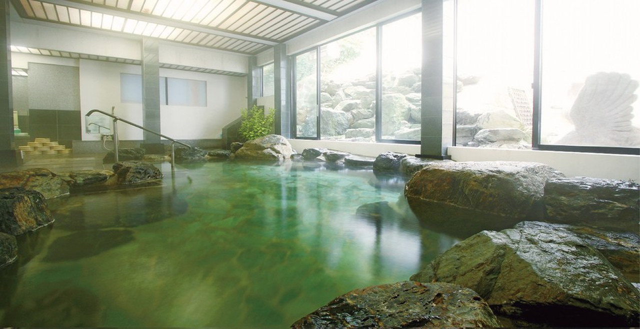 Rock-lined indoor bath.