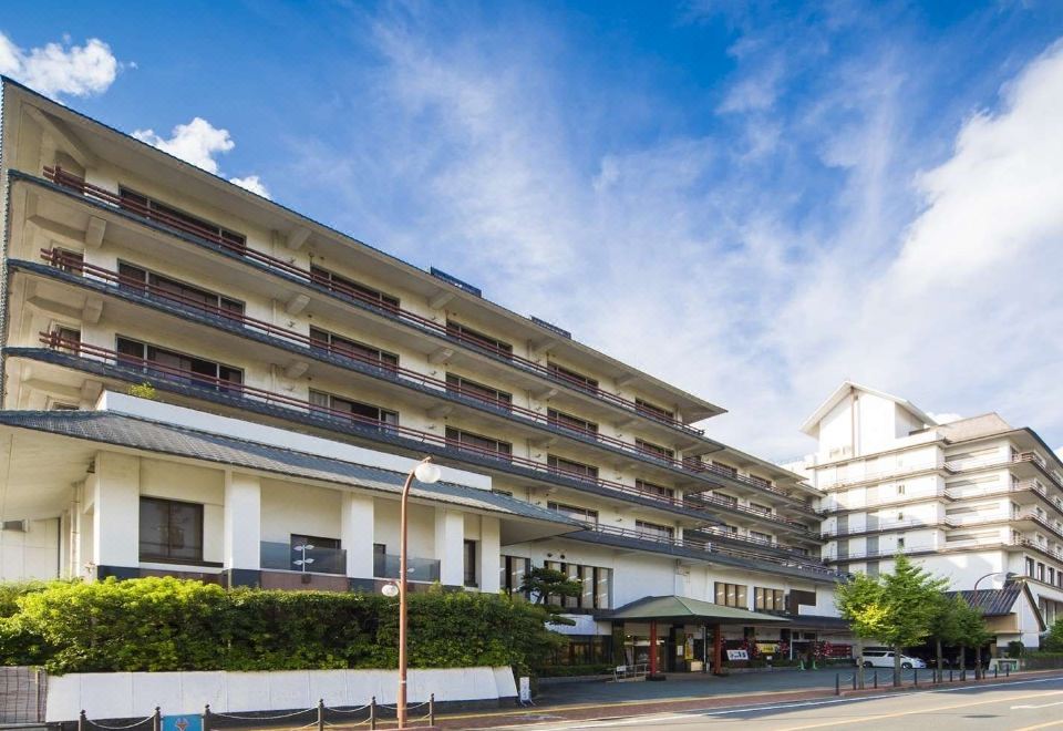 Multi-storey property exterior under a blue sky.