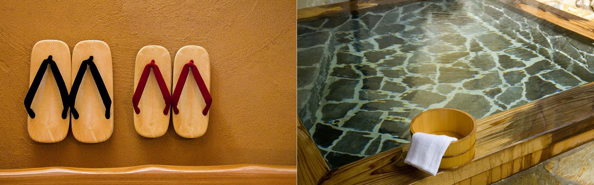 Yufuin Nanakawa Wooden sandal with red straps mounted on ochre textured wall.