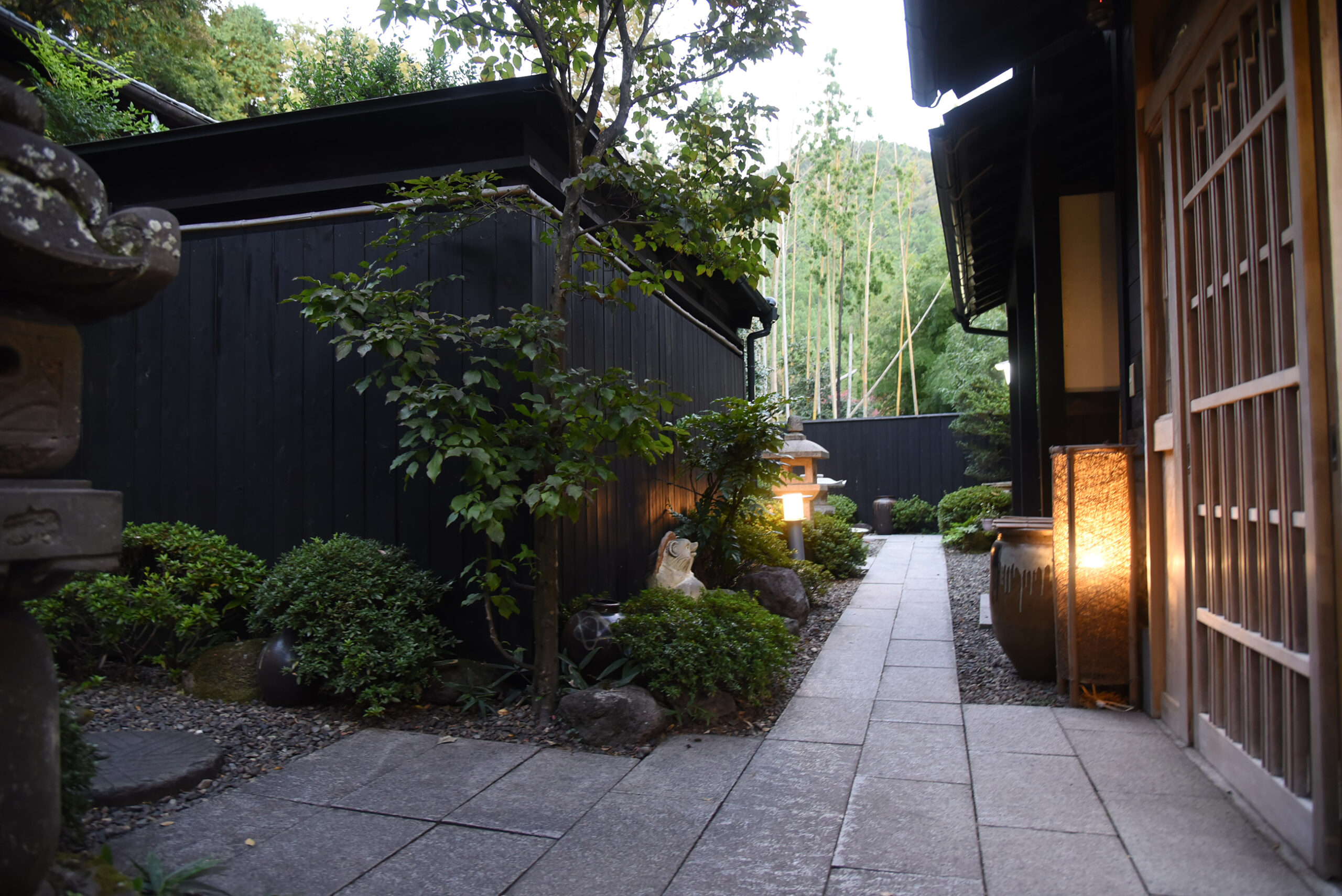 Stone path through a landscaped property entrance.