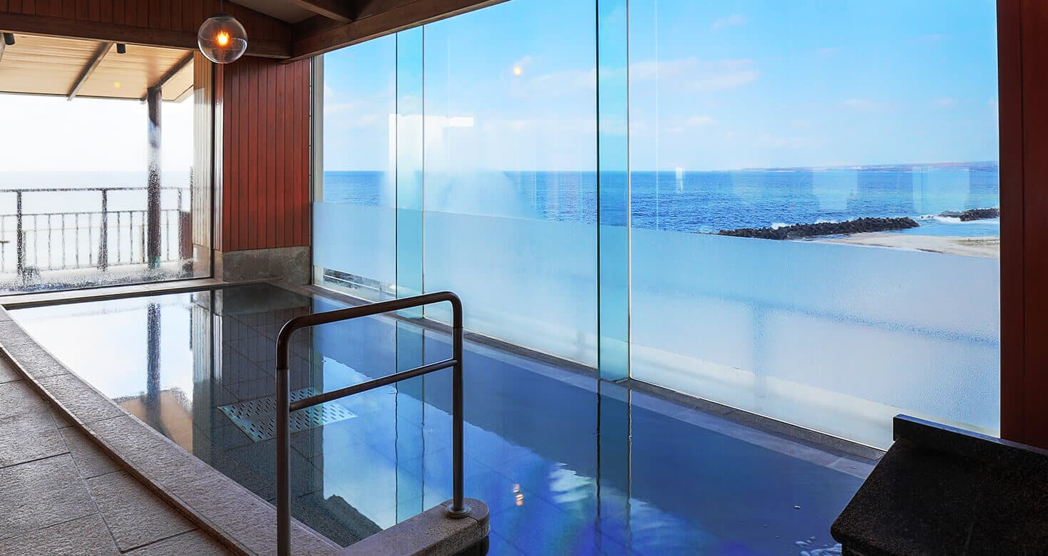 A glass-fronted communal bath overlooking the Sea of Japan.