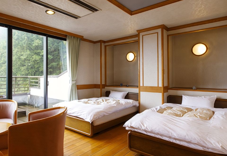 A twin bedroom opening to a balcony.