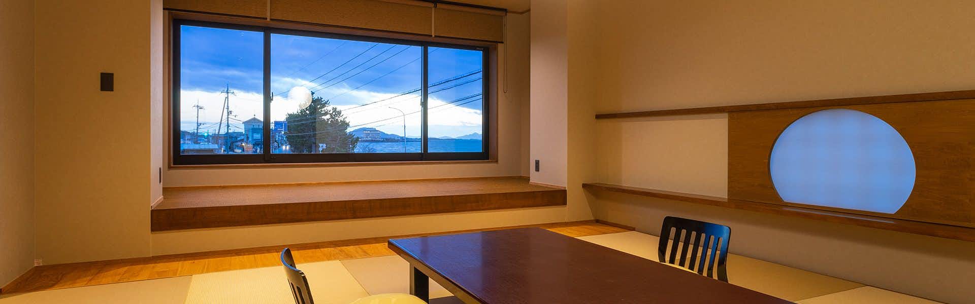Biwako Lakeside Gourmet Inn Futabasou with a tatami room opening toward the calm lakeshore.