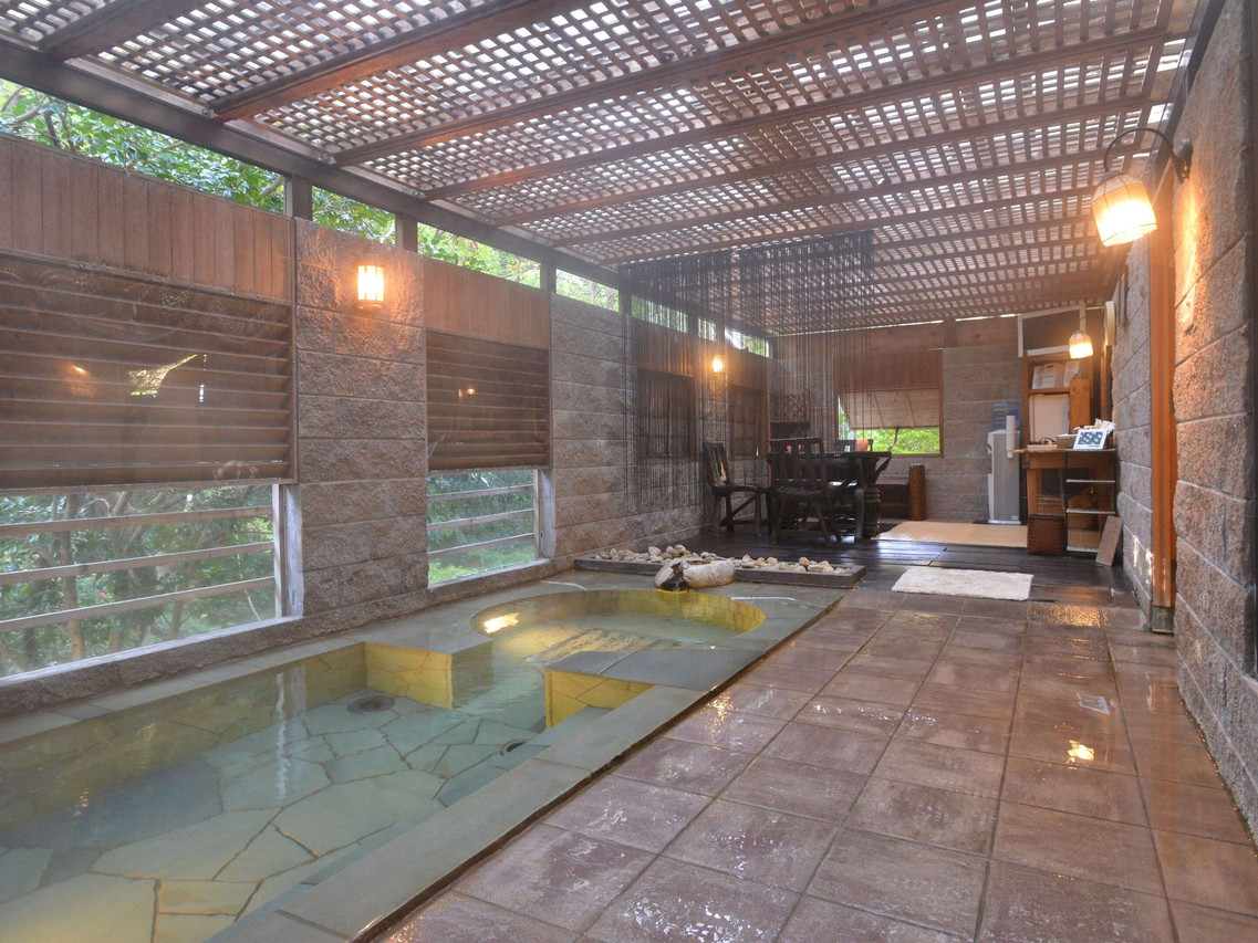 Covered outdoor bathing area.